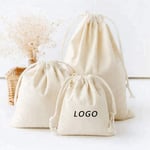 dispaly three custom canvas drawstring pouches in different sizes