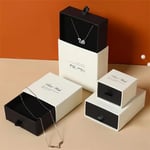 a bunch of white and black custom logo printed jewelry drawer boxes in different sizes