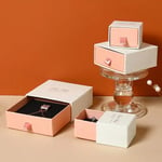 a bunch of white and pink custom logo printed jewelry drawer boxes in different sizes