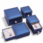 four custom navy blue jewelry boxes in drawer style