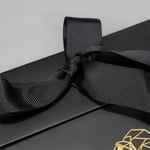 the ribbon bow detail of the custom gift paper bag with flap