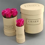 three cream colour custom flower gift tubes in different sizes