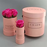 three pink custom flower gift tubes in different sizes