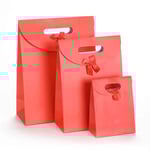 three red custom solid color die cut paper bags with flap