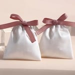 two white Custom Flannel Ribbon Pouches with ribbon bow