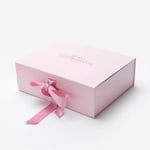 the pink custom flip top gift box with ribbon closure in the close state