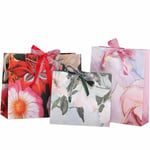 three custom colorful gift paper bags with ribbon bow in different sizes