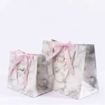 two custom colorful gift paper bags with ribbon bow in different sizes