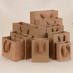 a bunch of the custom kraft brown gift paper bags in different sizes