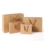 four custom kraft brown gift paper bags in different sizes