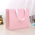 the custom pink gift paper bag from side angle