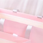 the handle detail of the custom pink gift paper bag