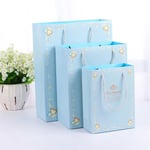 three blue custom matte lamination gift paper bags in different sizes