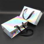 two lay-down custom holographic paper bags with ribbon handles