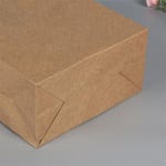 the bottom of the custom kraft paper bag with twisted paper handle