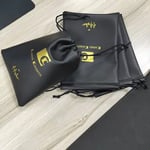 a bunch of black Custom Leather Drawstring Pouches