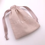 the front of one pink Custom Linen Ribbon Pouch