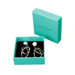 one cyan custom jewelry box with partial cover lid in the open state with a pair of earrings inside