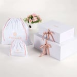 two white custom luxury eco-friendly clothing rigid boxes with ribbon closure and two white canvas bags